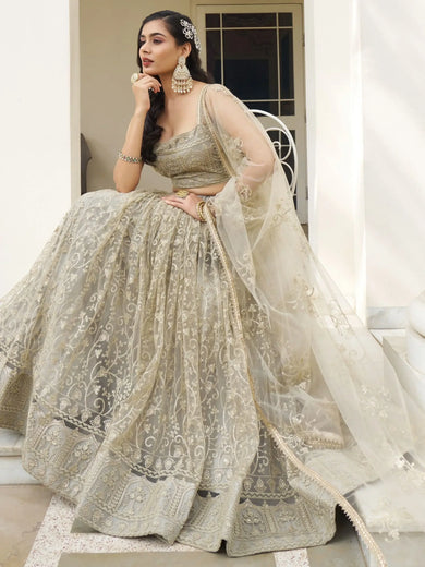 Mesmerizing Ivory Sequins Net Engagement Wear Lehenga Choli